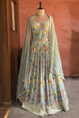 Light Sage Green Corset Lehenga featuring a voluminous Chinon Chiffon skirt