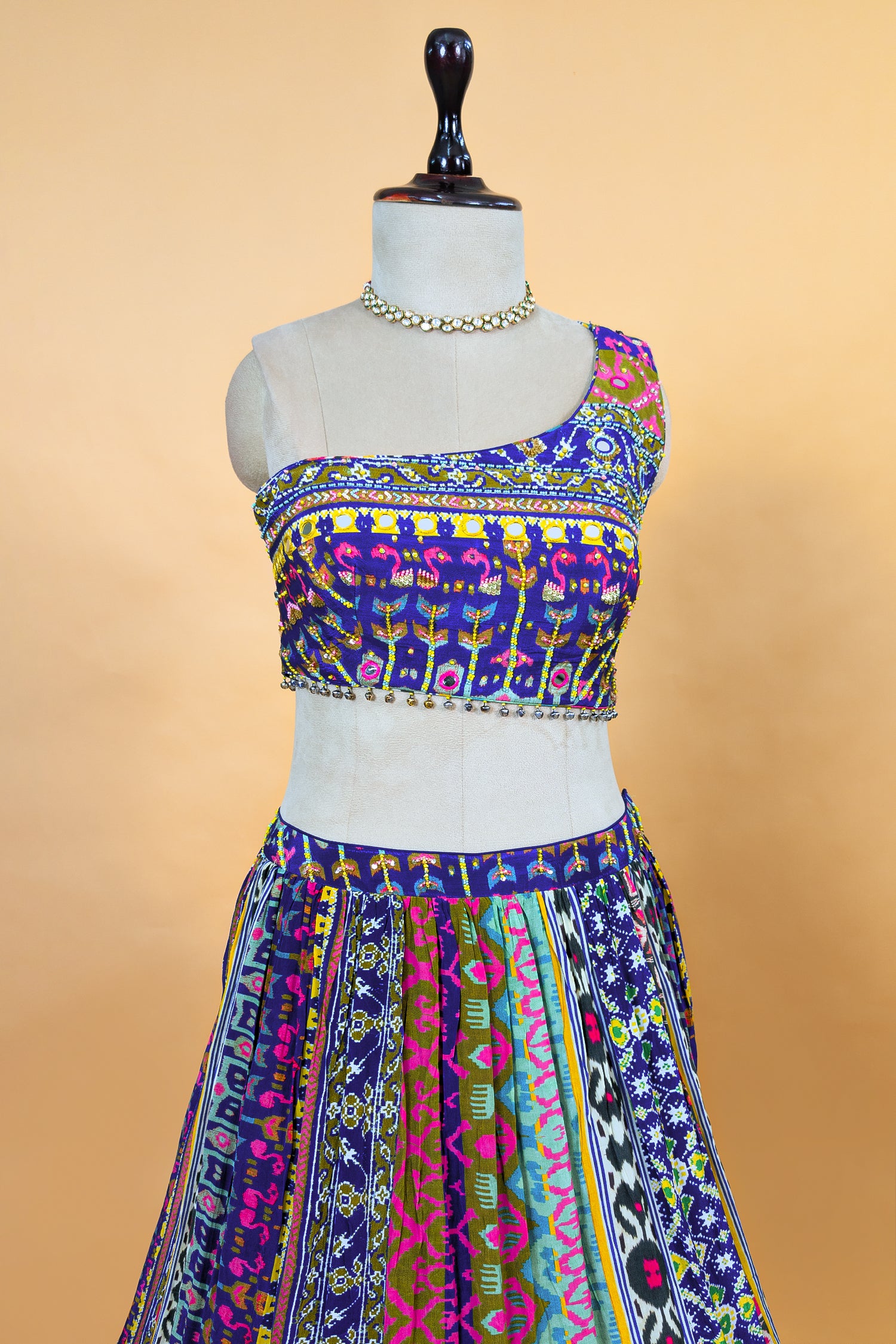 Blue Crepe Silk Printed Asymmetric Neckline Lehenga Set paired with a sheer net dupatta