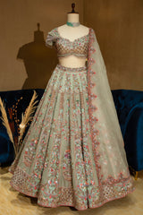 Green Organza Designer Handworked Lehenga with sheer sleeves and coordinated dupatta
