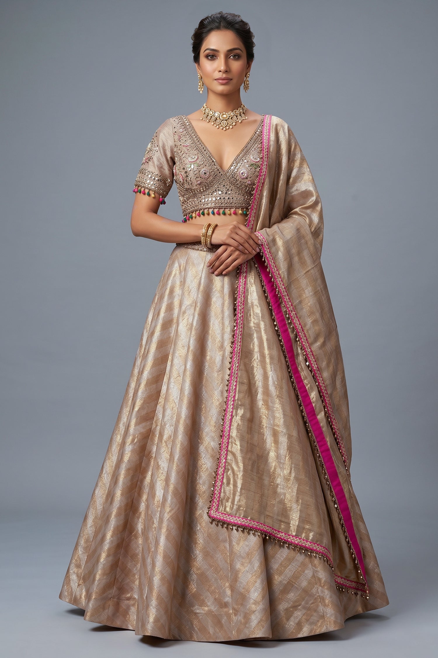 Golden Tissue Silk Lehenga with Kundan jewelry style embroidered blouse front view