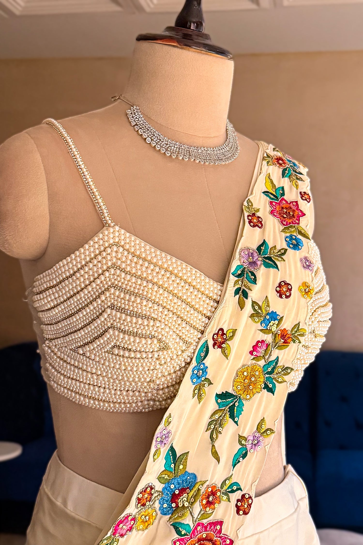 Cream Crepe Satin Silk Floral Embroidered Readymade Saree highlighting the pre-stitched seamless drape