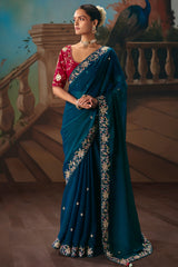 Teal Blue Viscose Chiffon Saree With Embroidered Border And Buti Work