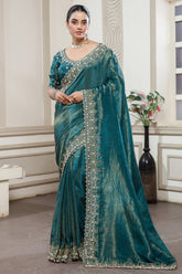 Peacock Blue Tissue Dola Silk Solid Saree with Readymade Blouse and Beaded and Zardosi Worked Border - blue silk saree