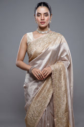 Close-up of intricate Cutdana and delicate beadwork on the Silver and Golden Tissue Silk Saree