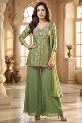 Model wearing Pista Green Chinon Silk Woven and Mirror Worked Palazzo Suit with Front Slit Peplum Kurta
