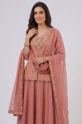 Close up of Dusty Peach Chinon Silk Fabric showing Gold Woven Butti and Mirror Embellishments