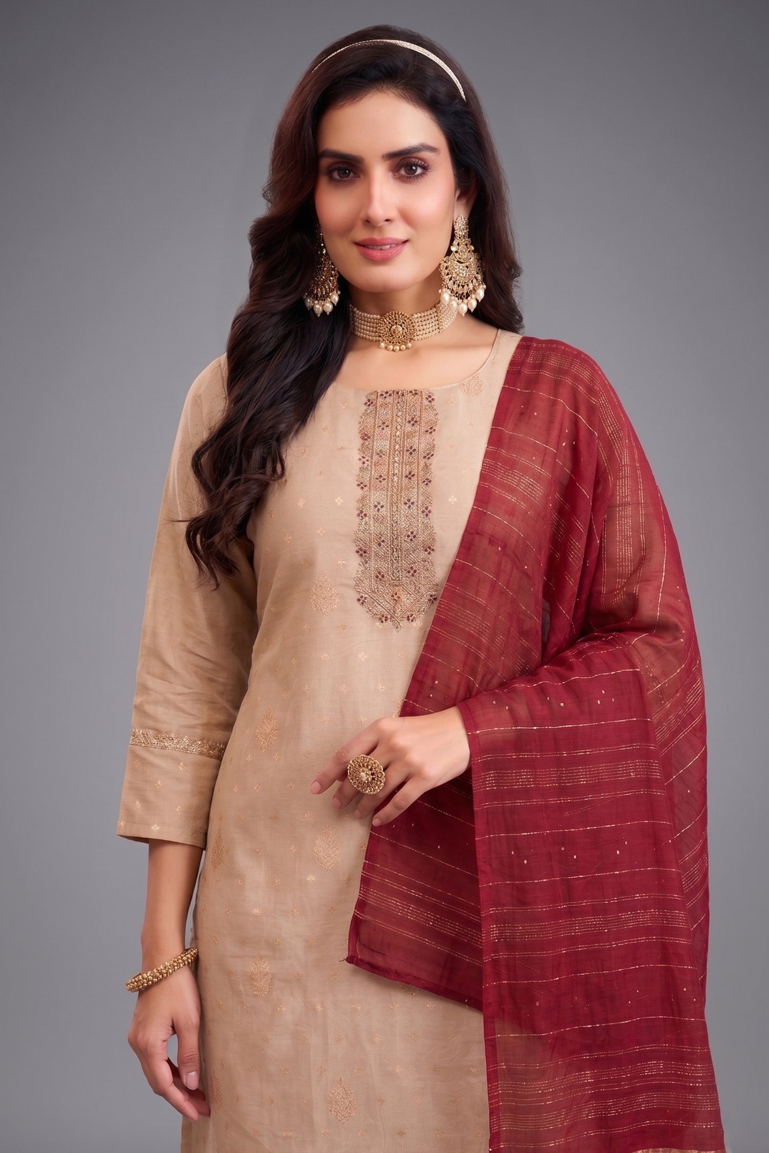 Close up of Pale Peach Tissue Woven Kurta and Contrasting Maroon Dupatta