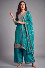 Turquoise blue art silk floral embroidered palazzo suit for festive wear