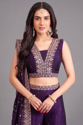 Close up of sequin and fine thread embroidery on purple crop top