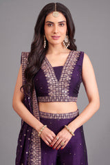 Close up of sequin and fine thread embroidery on purple crop top