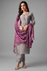 Light grey art silk straight cut suit with mauve embroidered neckline