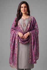 Close up of bead and thread embroidery work on light grey art silk suit