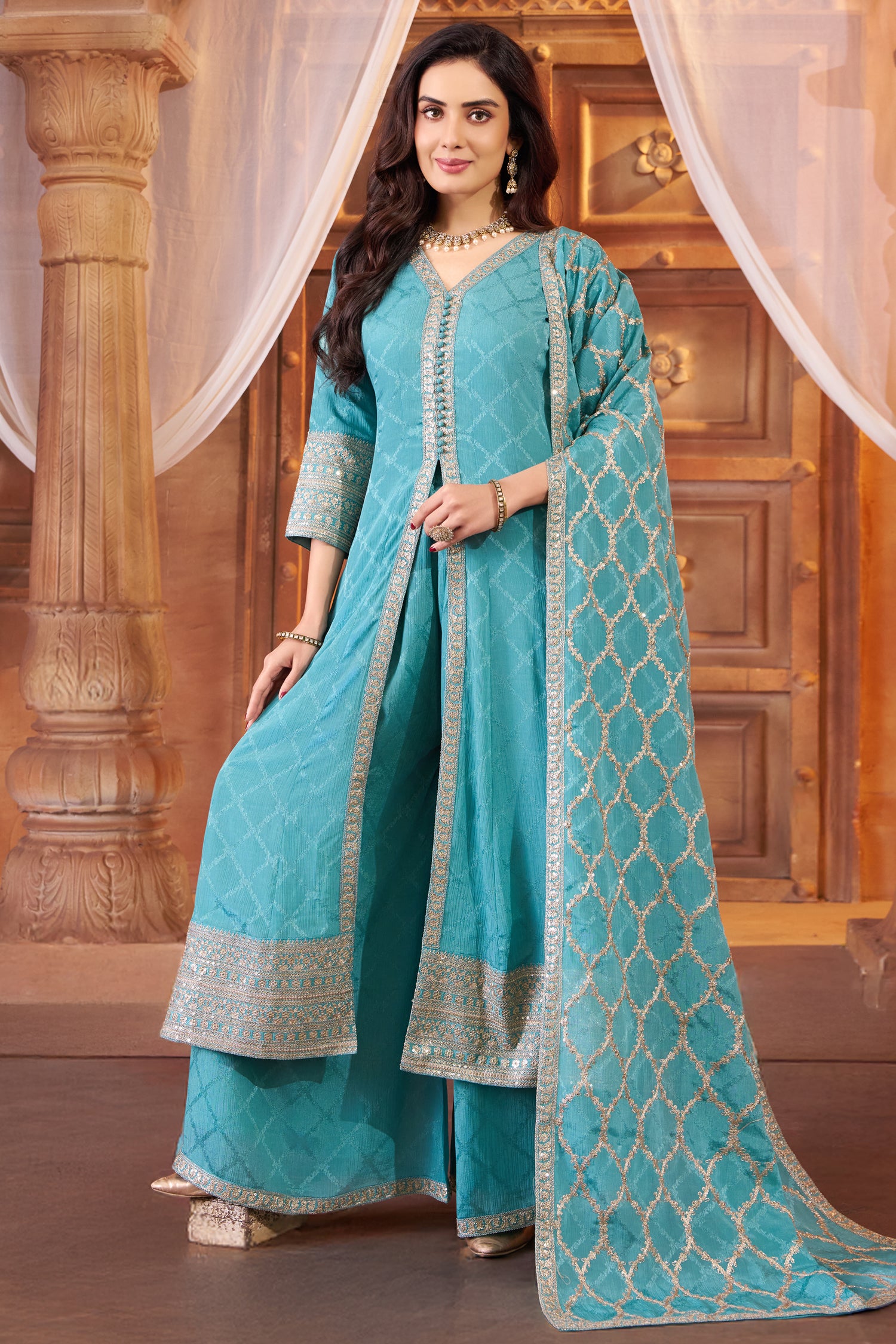 Model wearing sky blue chinon chiffon silk embroidered slit cut palazzo suit