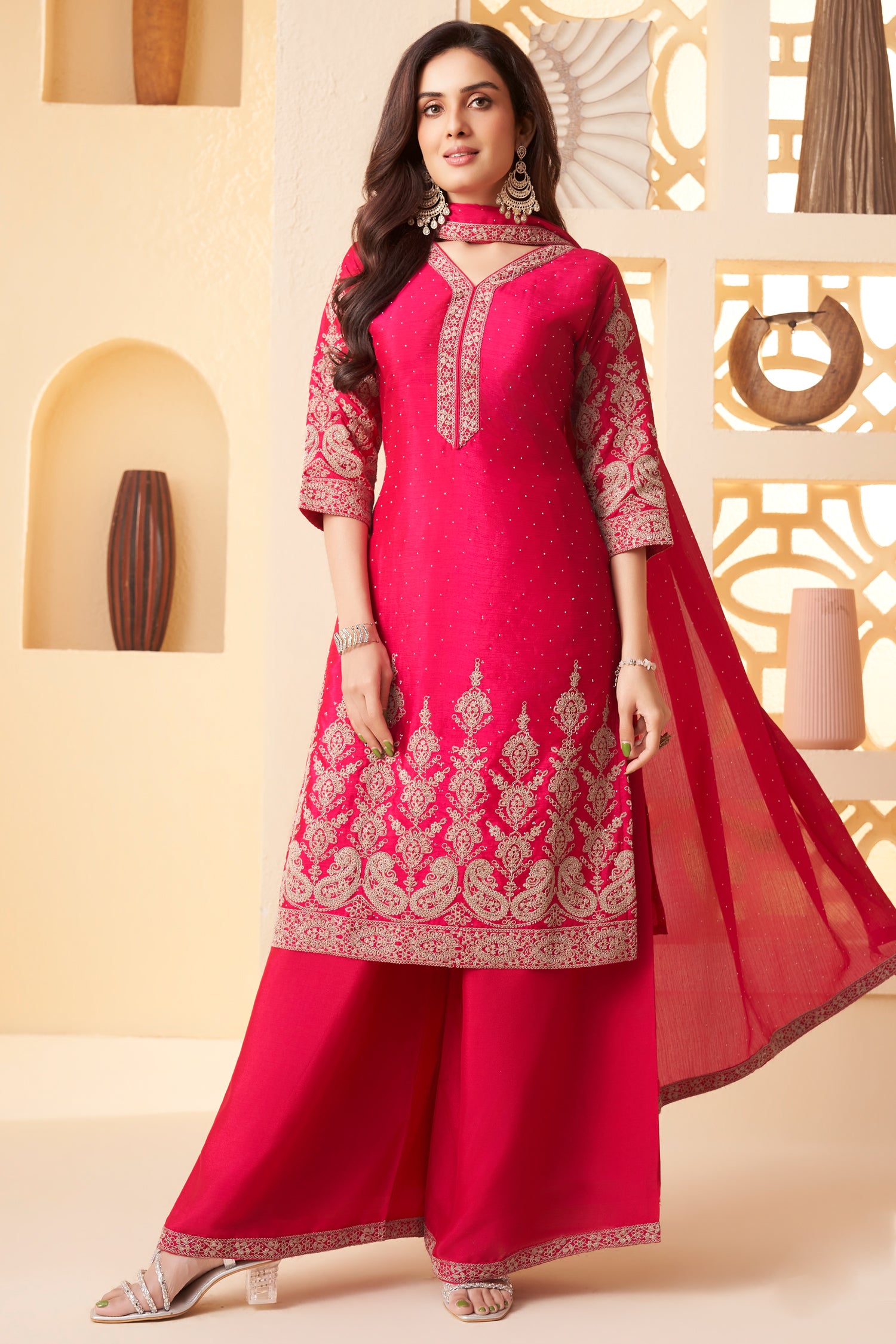 Model wearing traditional pink chinon silk embroidered straight cut suit