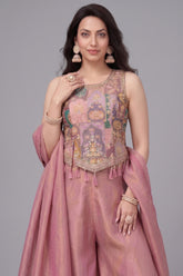 Detail of the printed crepe silk fabric and relaxed palazzo fit in onion pink.