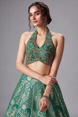 Green Banarasi Brocade Silk Zari Woven Lehenga with Zardosi Work Halter Neck Blouse