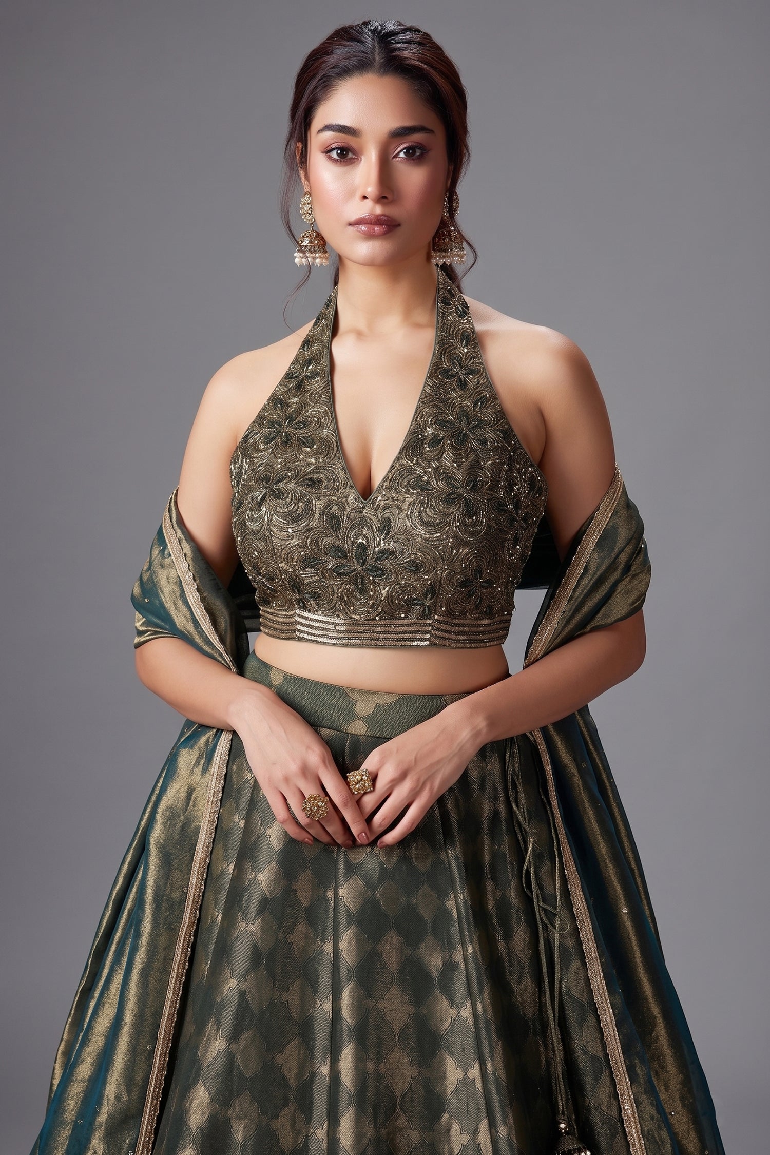Dark Green Tissue Zari Woven Lehenga with Handworked Halter Neck Blouse Secondary image