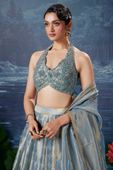Powder Blue Tissue Silk Zari Woven Lehenga with Handworked Halter Neck Blouse