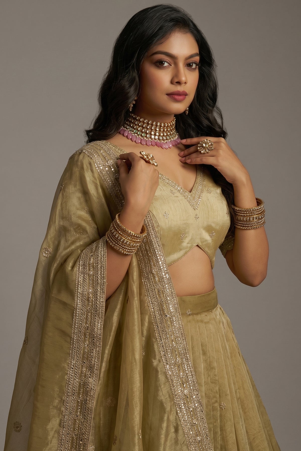Close-up of high-definition Zari, Dori, and Sequins on the Muted Pistachio Gold Crepe Lehenga with Sequins Border