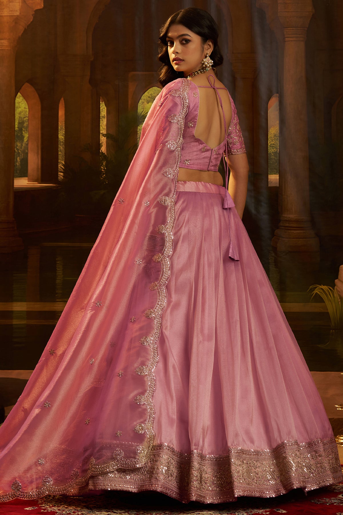 Dusty Rose Pink Organza Lehenga styled with elegant pearl jewelry