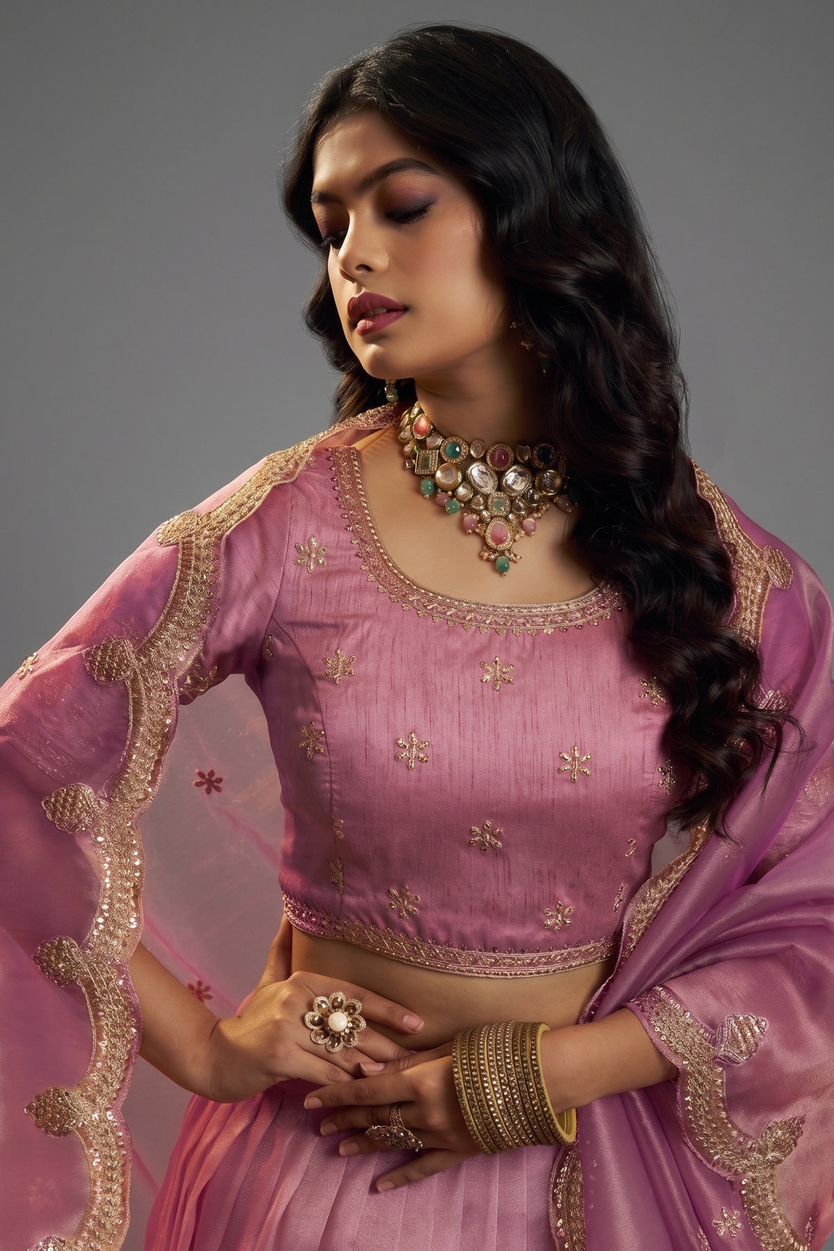 Close-up of high-definition Zari, Dori, and Sequins on the Dusty Rose Pink Organza Lehenga
