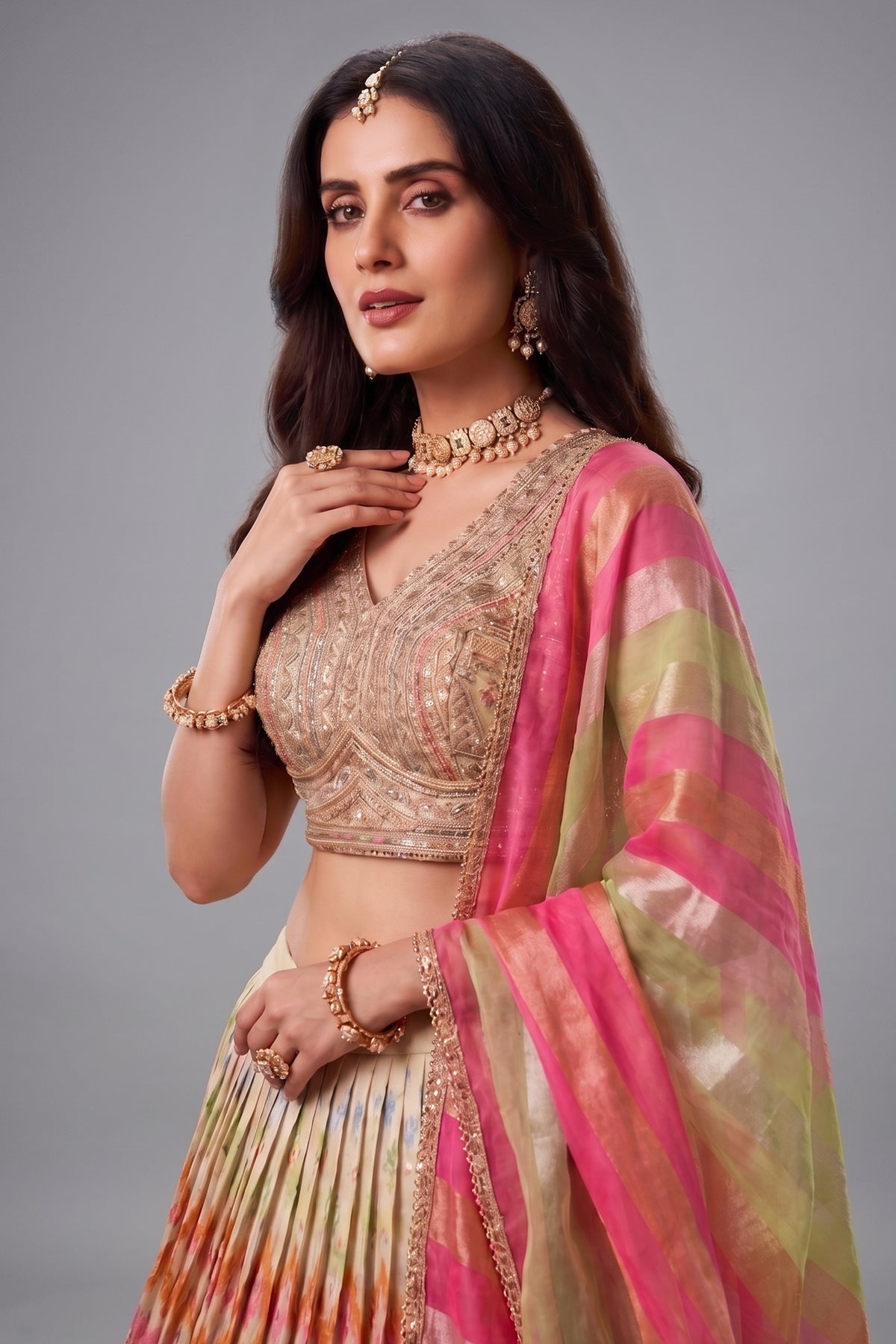 Cream organza embroidered lehenga with pink blouse - side view