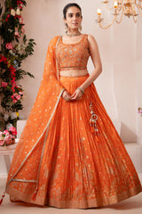 Elegant orange organza woven pleated lehenga traditional Indian attire