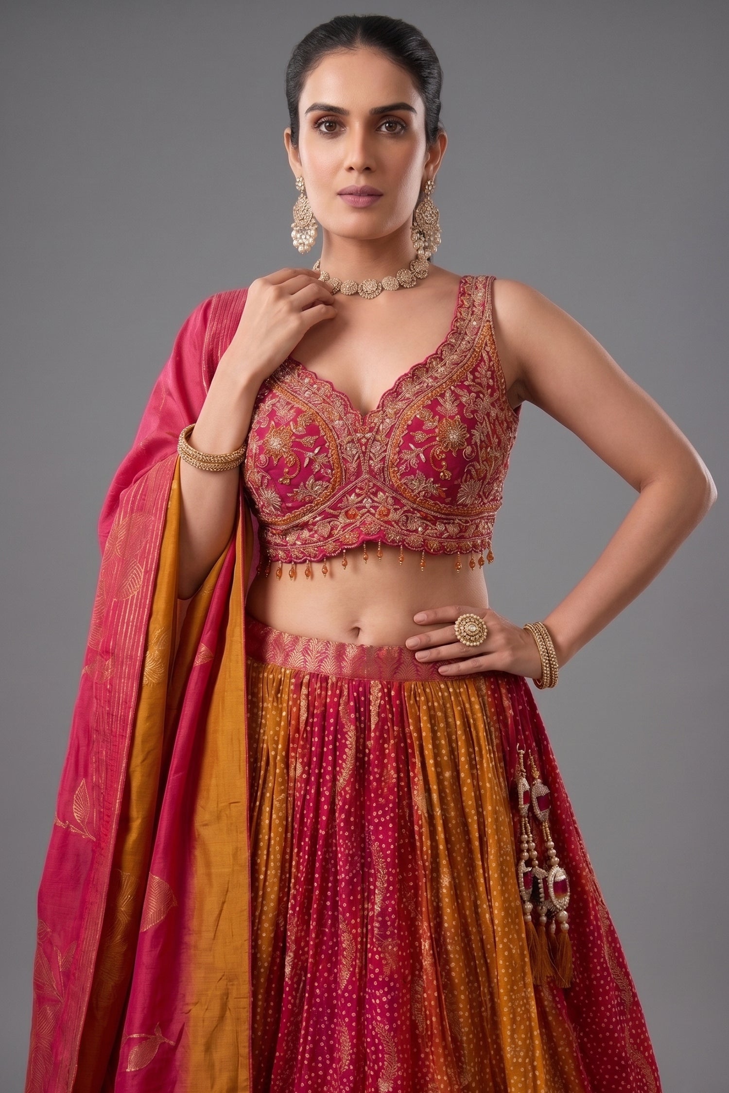 Close up design of multi colored ombre organza bandhej lehenga