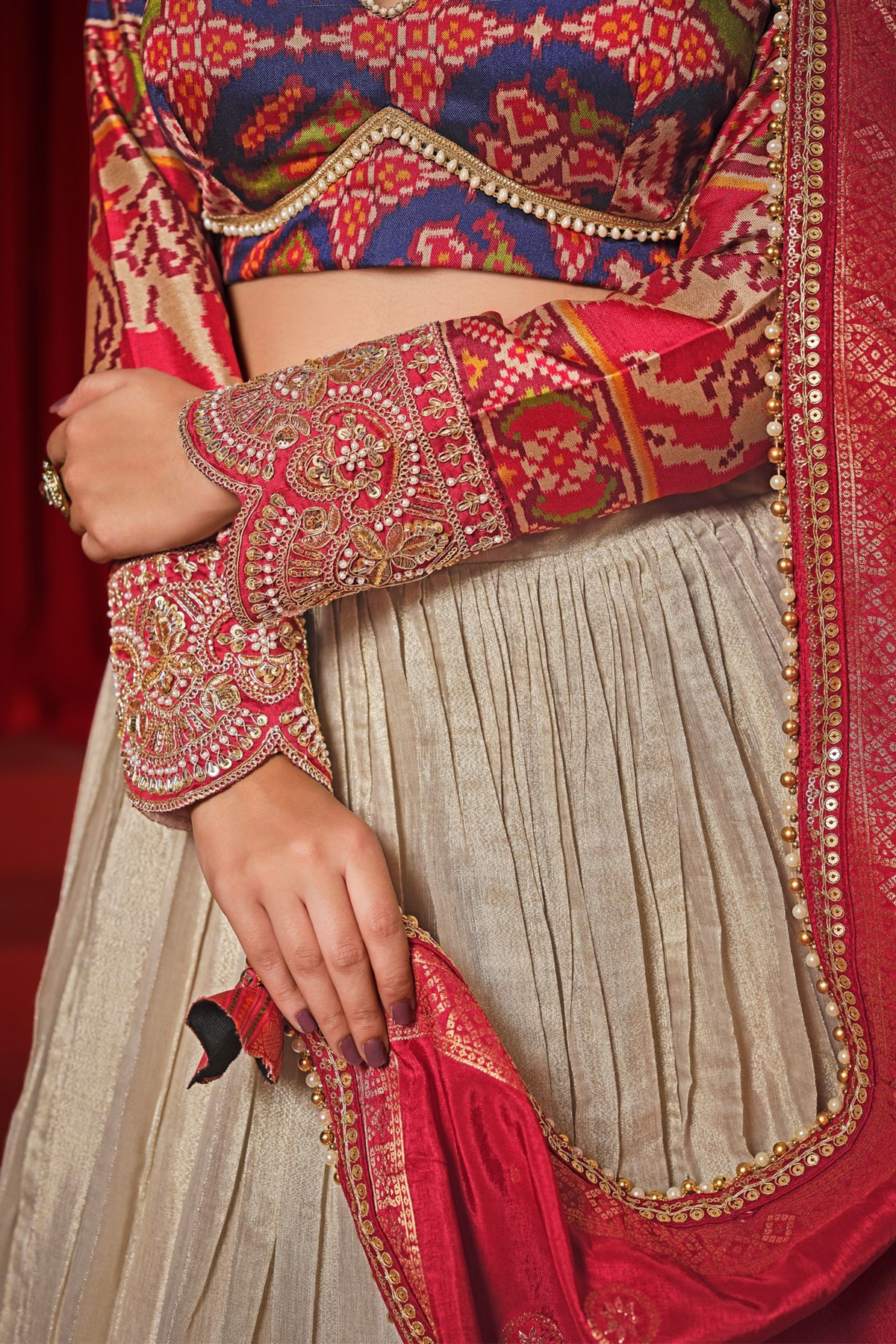 Cream and Gold Tissue Lehenga with Patola Choli and Rust Red Embroidered Dupatta