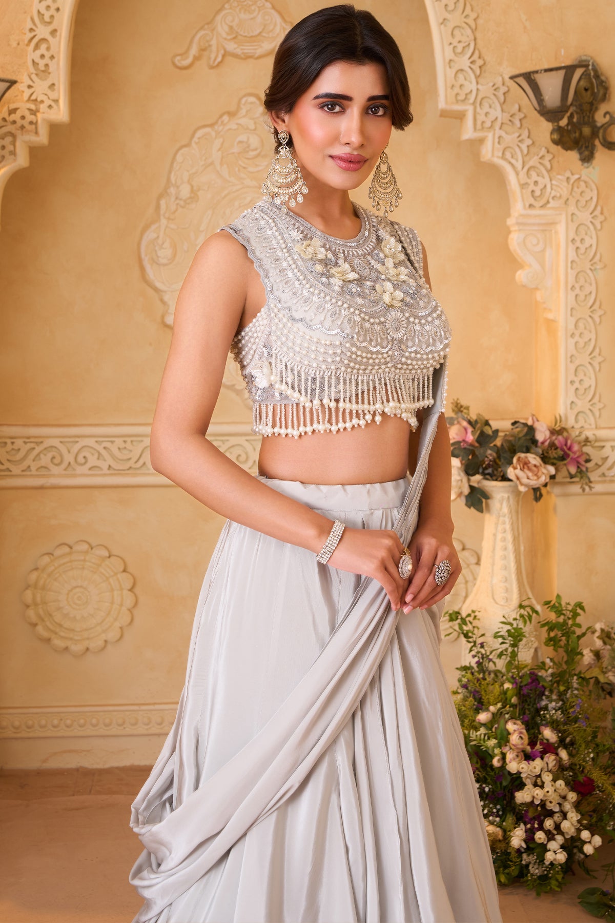 Ivory White Pre-Draped Lehenga featuring heavily Embroidered Pearl Fringe Blouse with Attached Dupatta