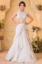 Ivory White Pre-Draped Lehenga featuring heavily Embroidered Pearl Fringe Blouse with Attached Dupatta