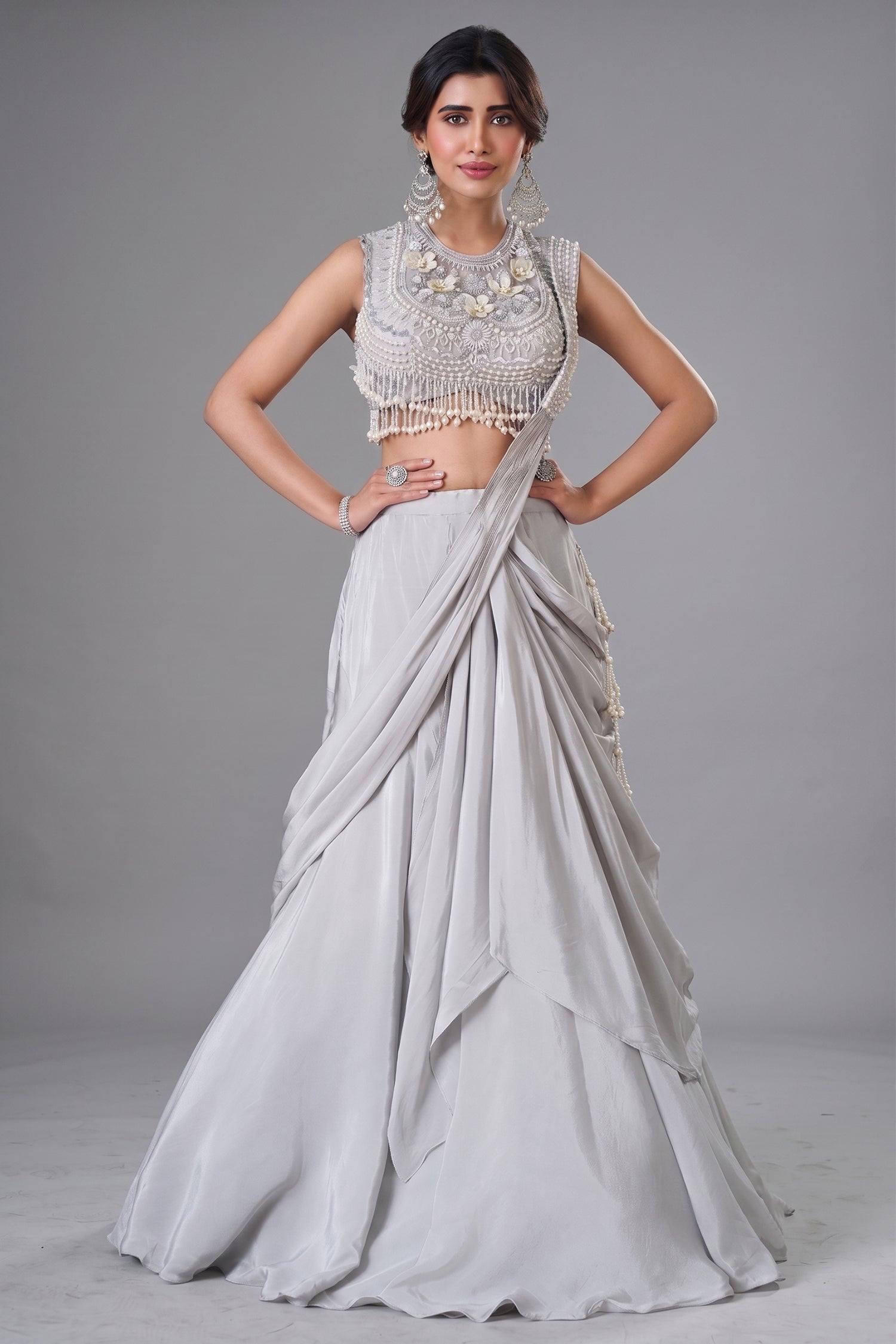 Ivory White Pre-Draped Lehenga featuring heavily Embroidered Pearl Fringe Blouse with Attached Dupatta Main image