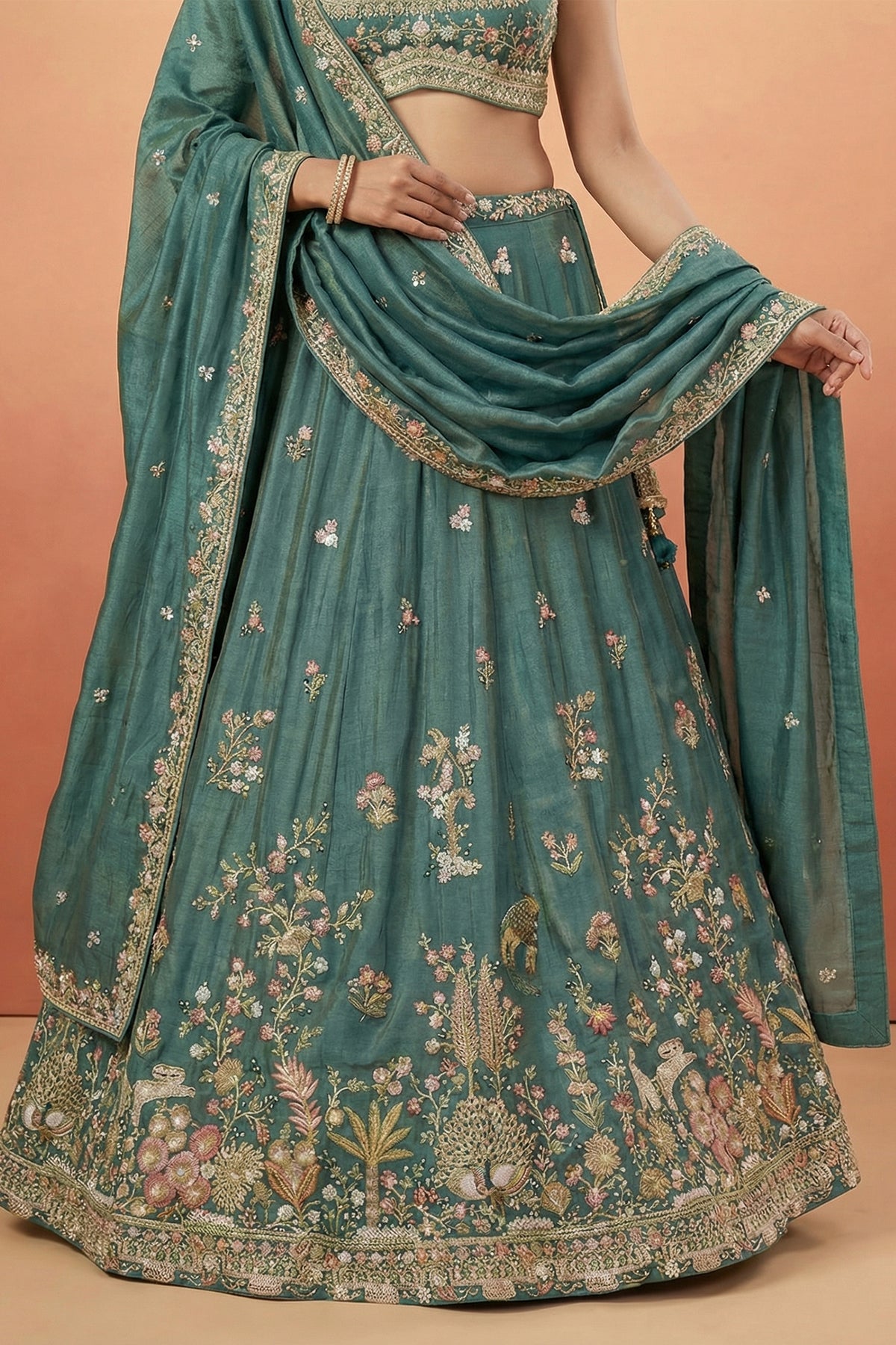 Deep Rama Tissue Lehenga Choli with Scenic Peacock & Animal Motif Embroidery