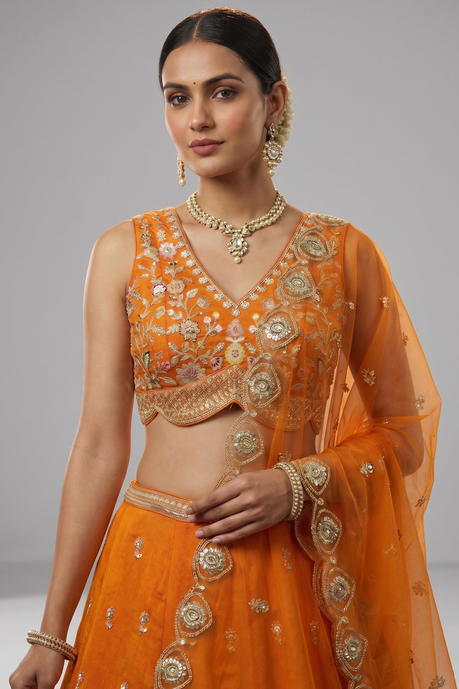 Orange Tissue Lehenga Choli with Scalloped Jharokha and Peacock Embroidery Secondary image