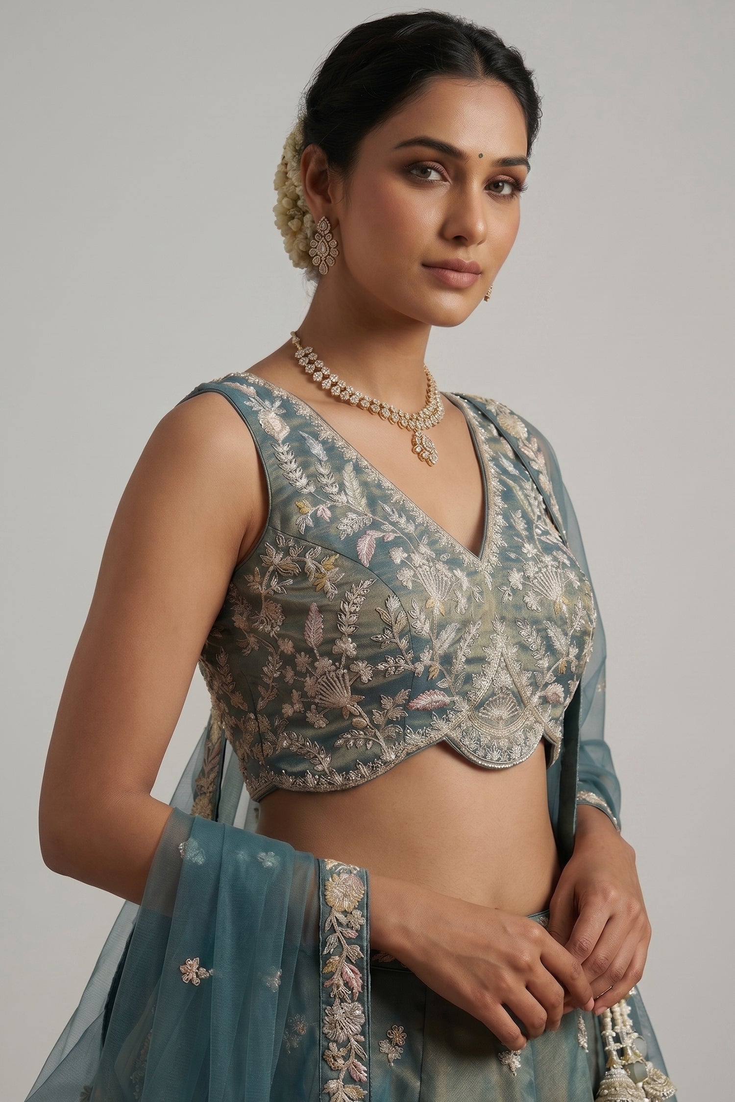 Metallic Teal Tissue Lehenga Choli with Floral Border Secondary image