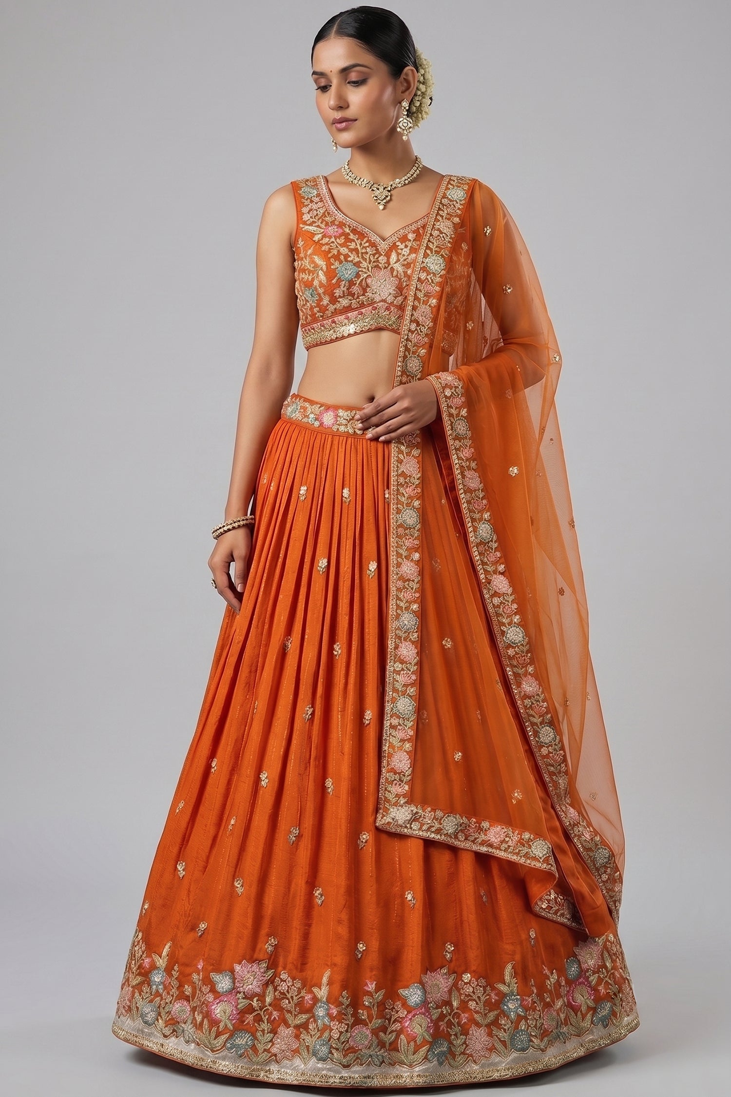 Orange Pleated Georgette Lehenga Choli with Embroidered Hem Main image