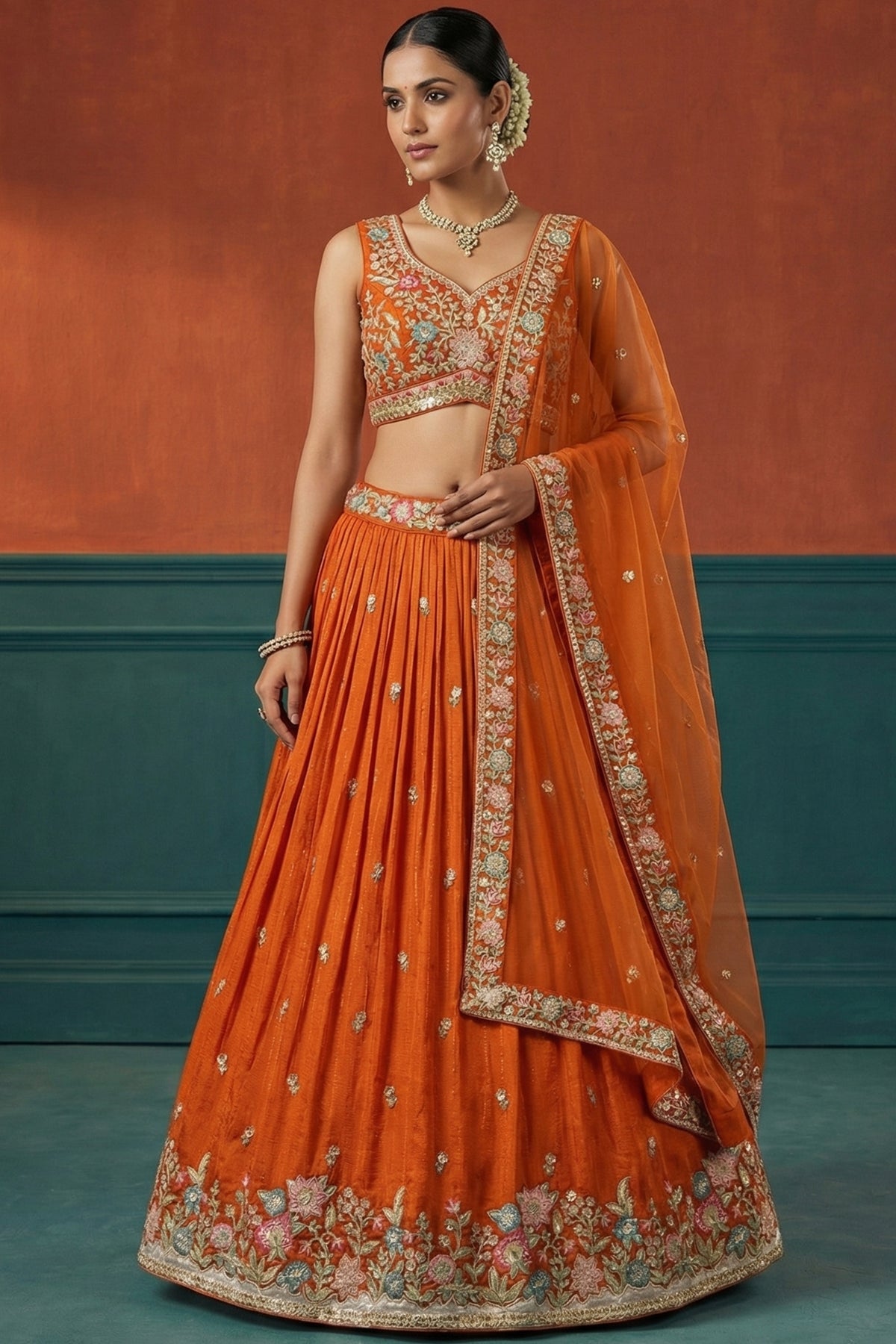 Orange Pleated Georgette Lehenga Choli with Embroidered Hem