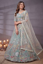 Ice Sky Blue Soft Net Lehenga Choli highlighted with Multi-Color Botanical Embroidery