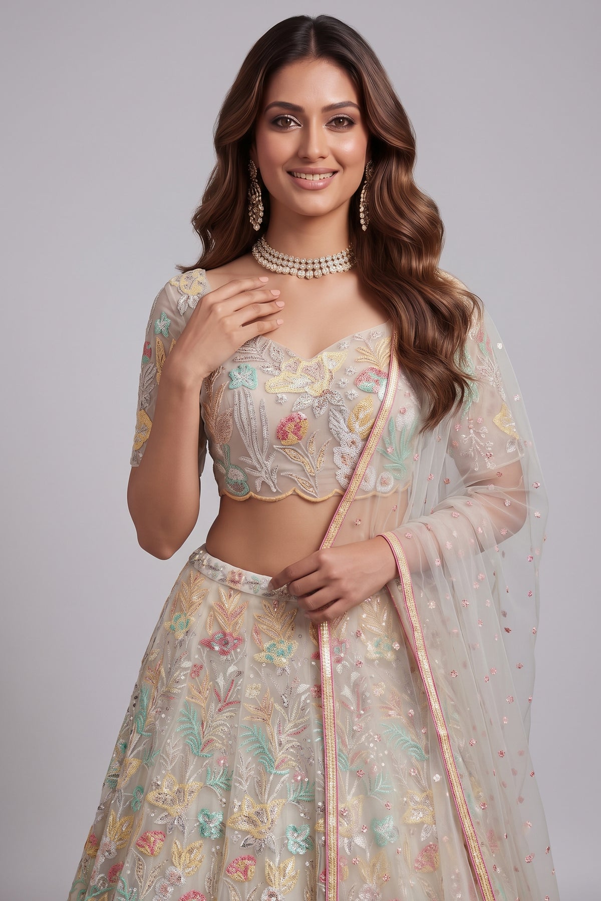 Pristine White Soft Net Lehenga Choli with Multi-Colored Floral Thread Embroidery