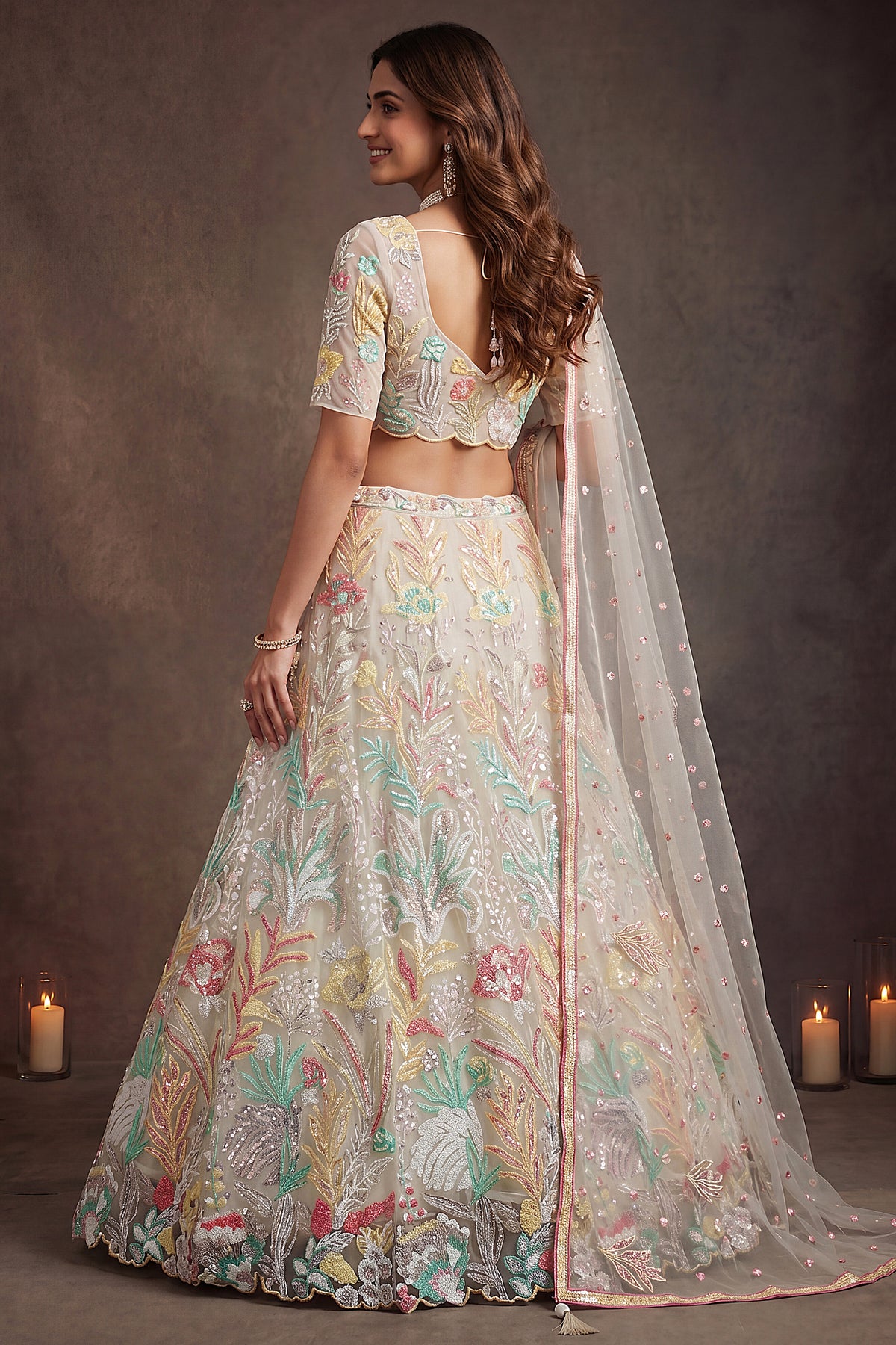 Pristine White Soft Net Lehenga Choli with Multi-Colored Floral Thread Embroidery