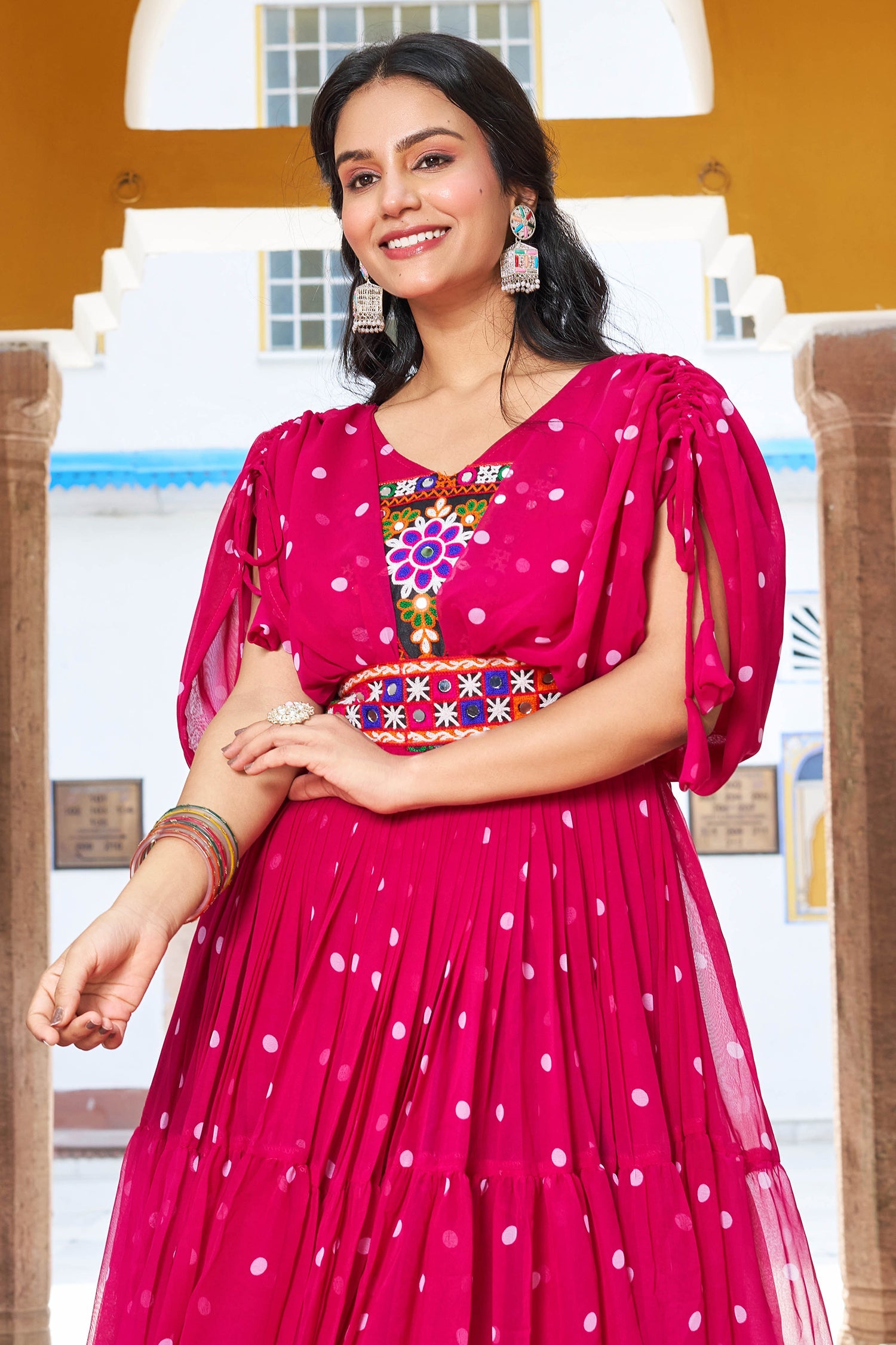 Pink Georgette Polka Dots Printed Flared Cape Sleeved Kurti with Kachchi Work Bodice