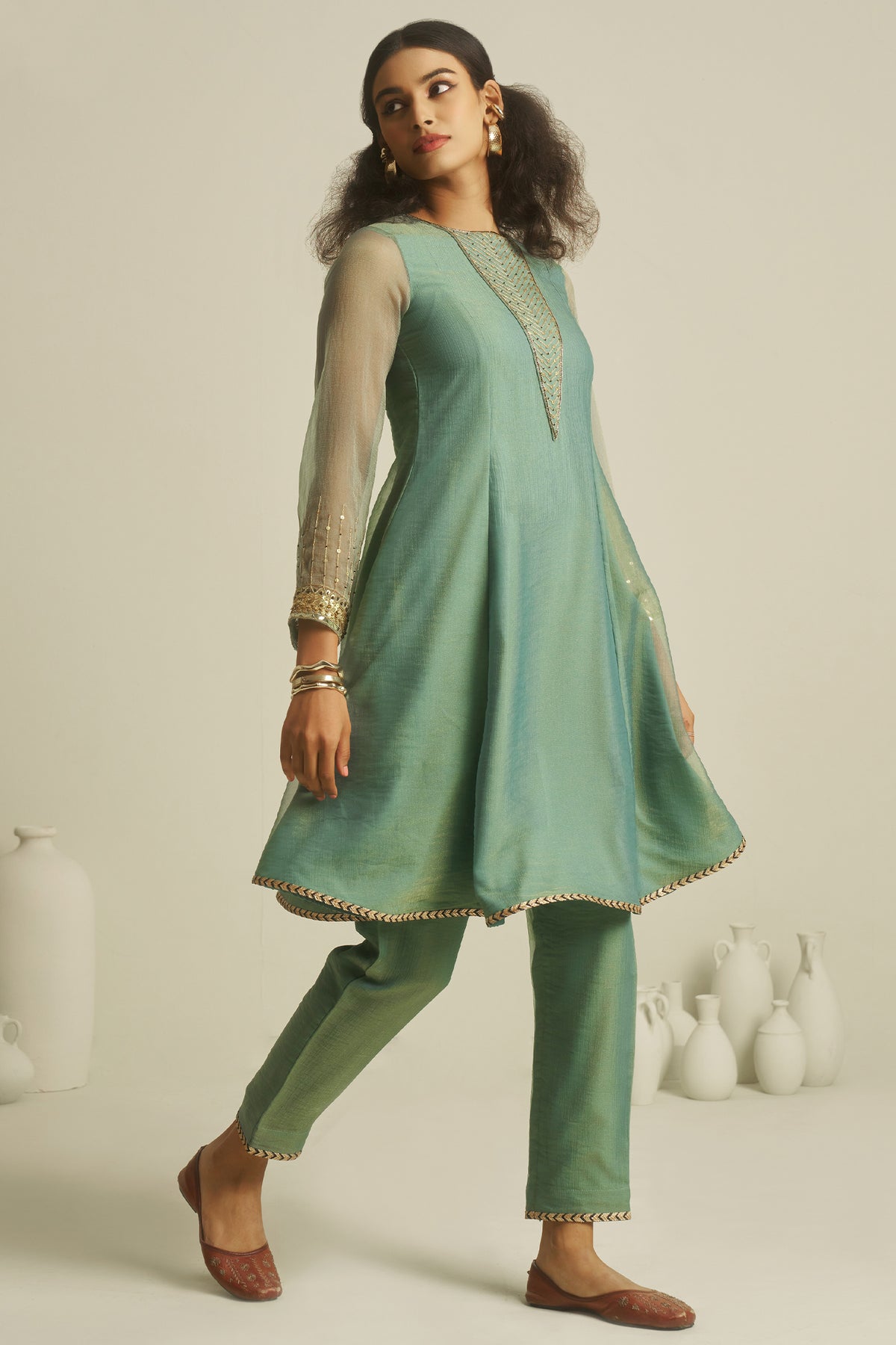 Sea Green Tissue Sequinned Kurti with Pant offering a majestic and structured drape