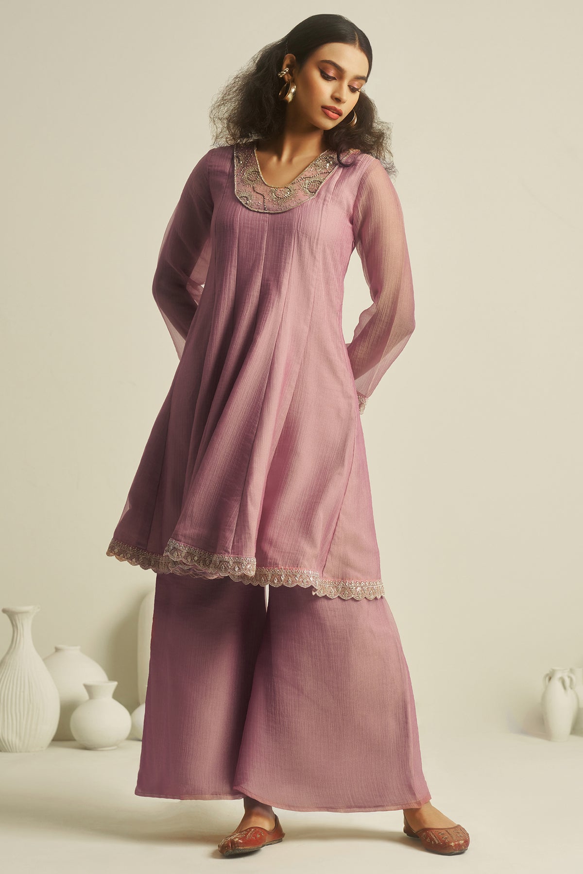 Deep Pastel Pink Tissue Sequinned Kurti with Bottom styled with traditional Kundan jewelry