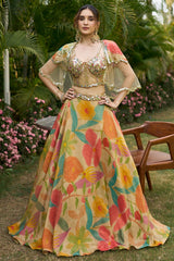 Beige Tissue Floral Printed Lehenga with Embellished Corset and Cape Sleeve