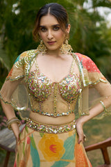 Beige Tissue Floral Printed Lehenga with Embellished Corset and Cape Sleeve
