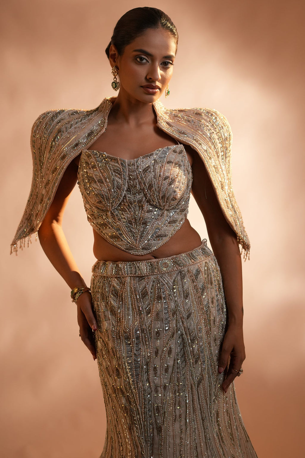Blush Pink Net Mermaid Lehenga Set with Structured Corset Blouse and Embellished Shoulder Cape