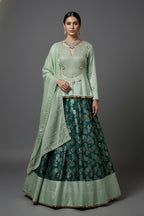 Teal Green Brocade Banarasi Silk Floral Woven Lehenga with Peplum Blouse - green silk saree
