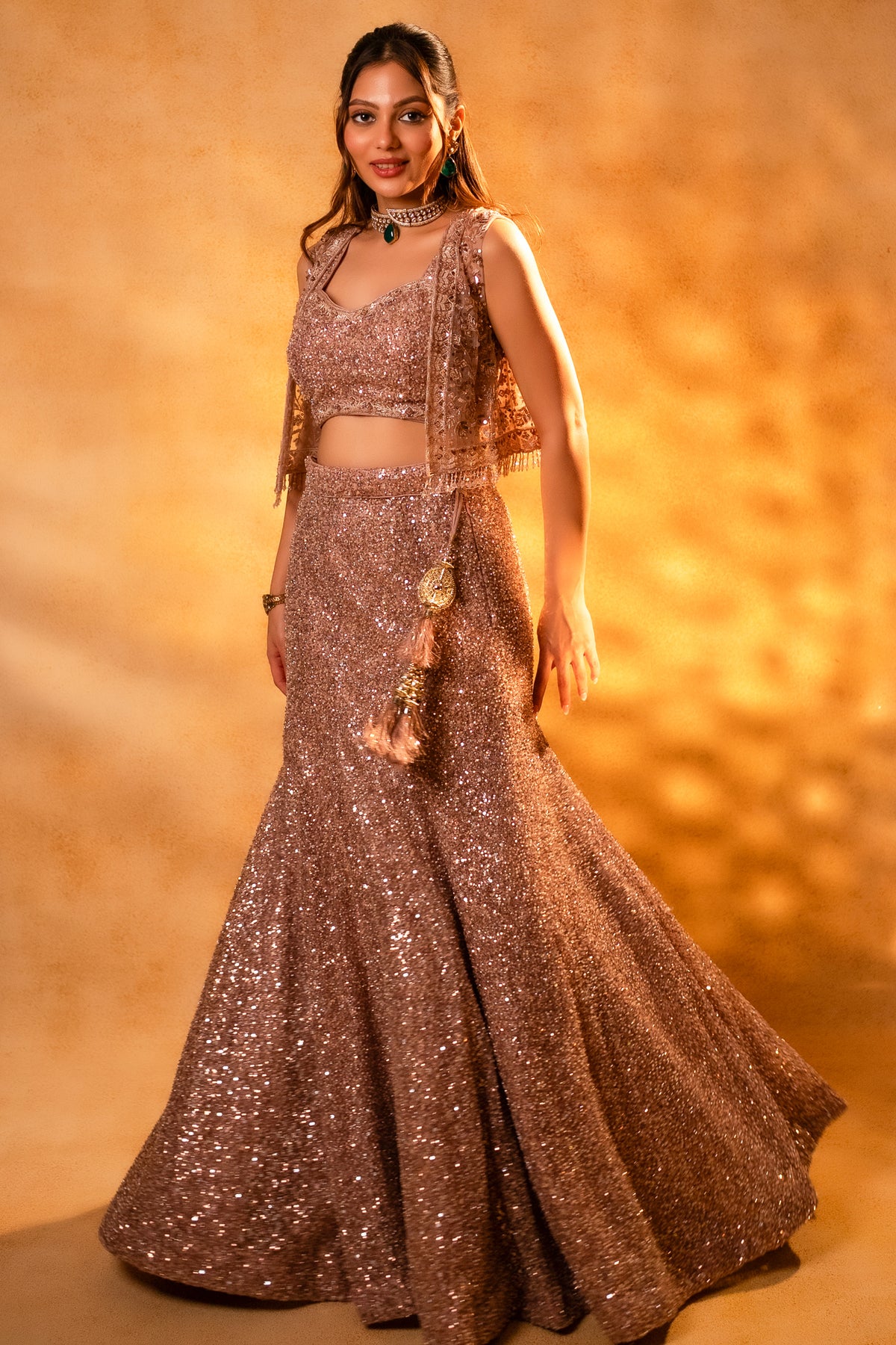 Designer Dusty Pink Net Sequinned Fish Cut Lehenga paired with a structured short jacket