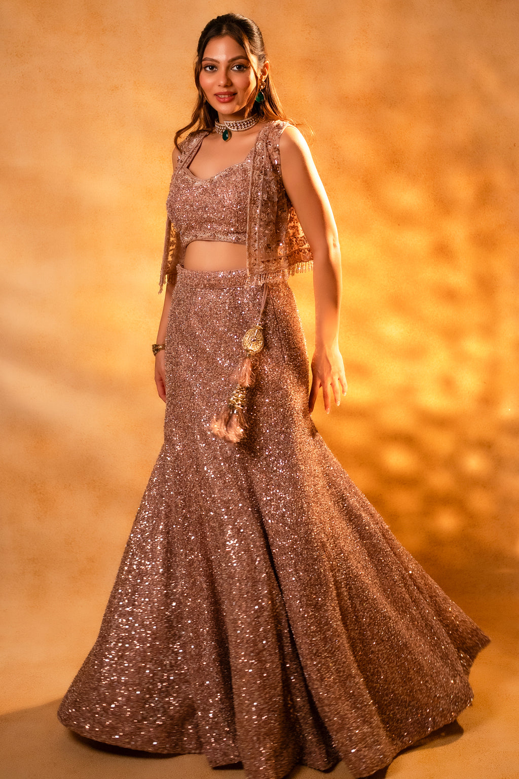 Designer Dusty Pink Net Sequinned Fish Cut Lehenga paired with a structured short jacket