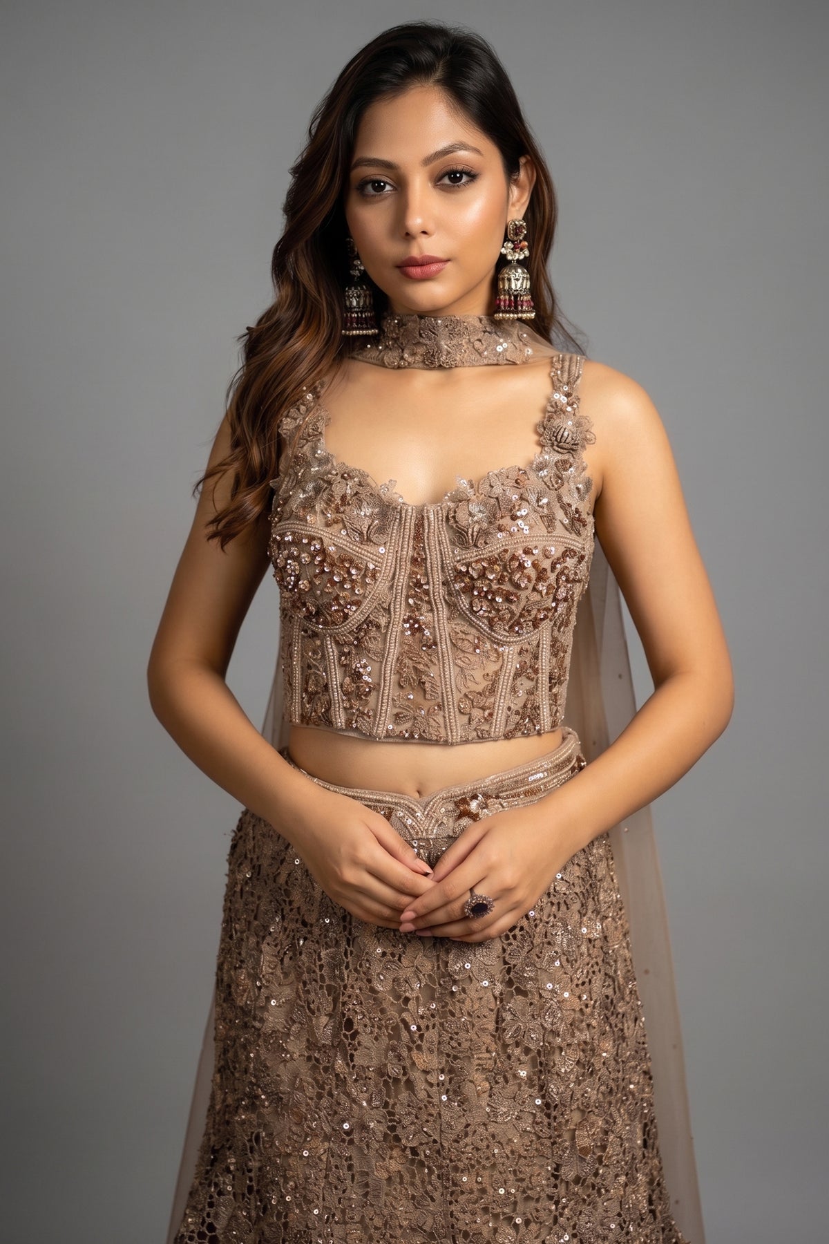 Close-up of shimmering sequins, cutdana, and beadwork on the Rose Gold Net Sequinned Fish Cut Lehenga with Corset Blouse